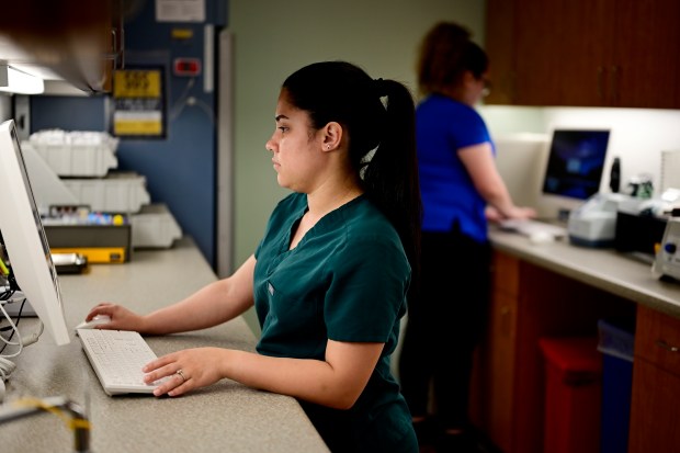 Medical assistant Ashely Arce works at the Doctors Care clinic in Littleton on Thursday, May 30, 2024. (Photo by Hyoung Chang/The Denver Post)